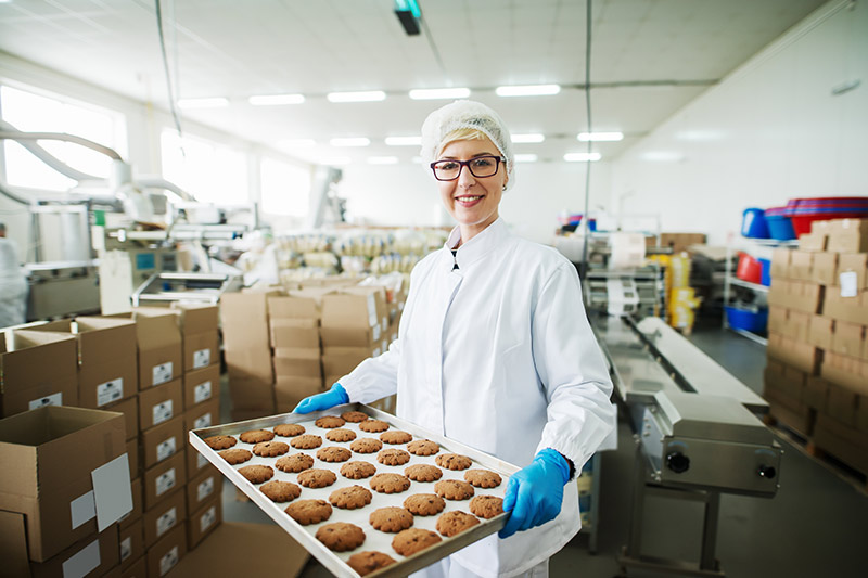 female baker inside a food processing company