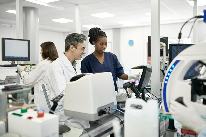 two lab technicians collaborating in a medical lab