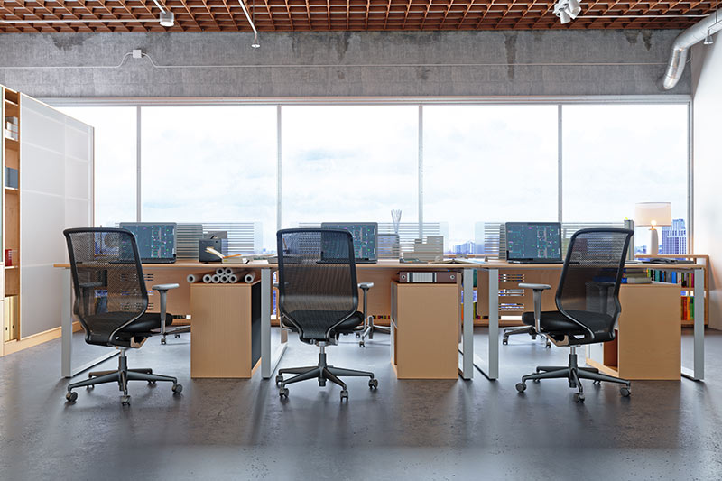 modern office furniture in an office with a city view