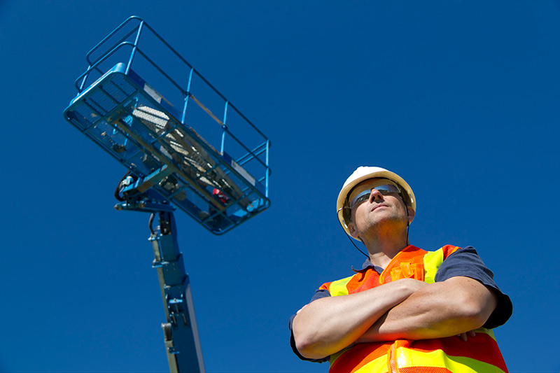 boom lift operator at a construction site