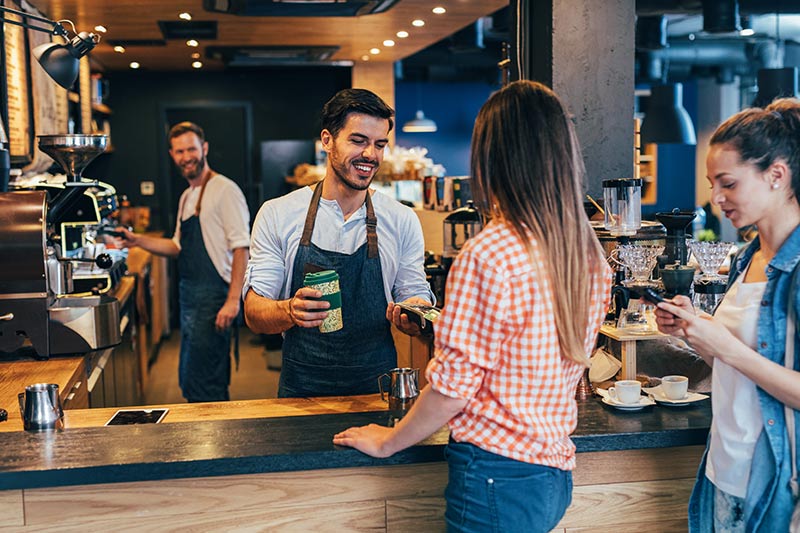 barista serving coffee to customer, coffee franchise financing