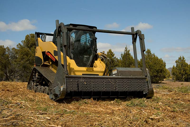 mulcher financing, large yellow and black mulching machine in a field
