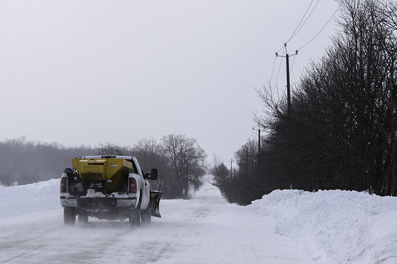 pickup truck on snow highway, salt spreader financing