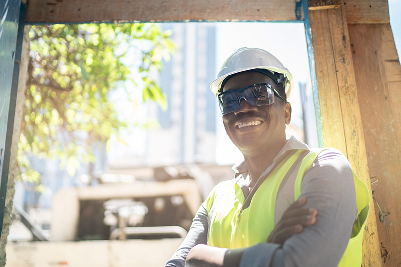 construction worker smiling at jobsite