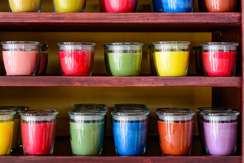 rows of colorful candles in a candle store, candle shop business loans