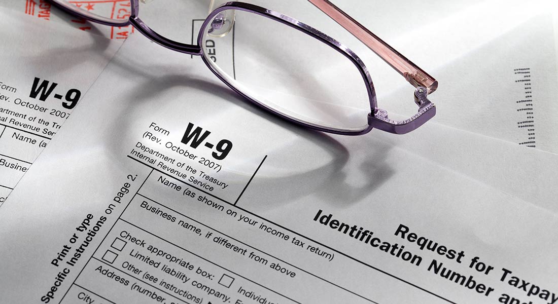eyeglasses next to irs w-9 form, guide to tax form w-9