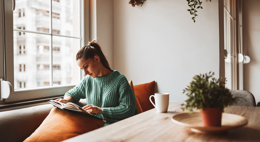 woman reading a book, how to get energized for the new year