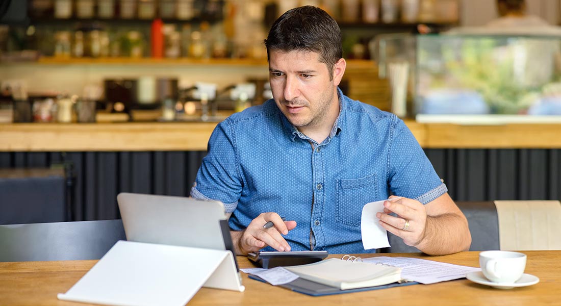 male restaurant owner doing work on a tablet, guide to irs form 4562