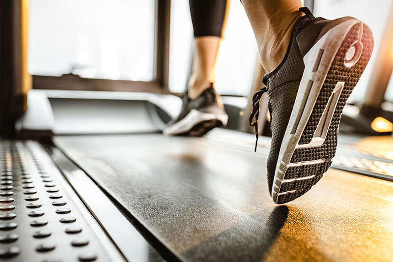 close up of athletic shoes on treadmill, fitness equipment vendor financing