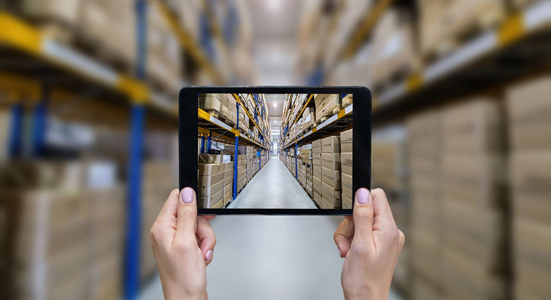 hands holding wireless tablet taking photos of warehouse inventory, three equipment vendor marketing strategies
