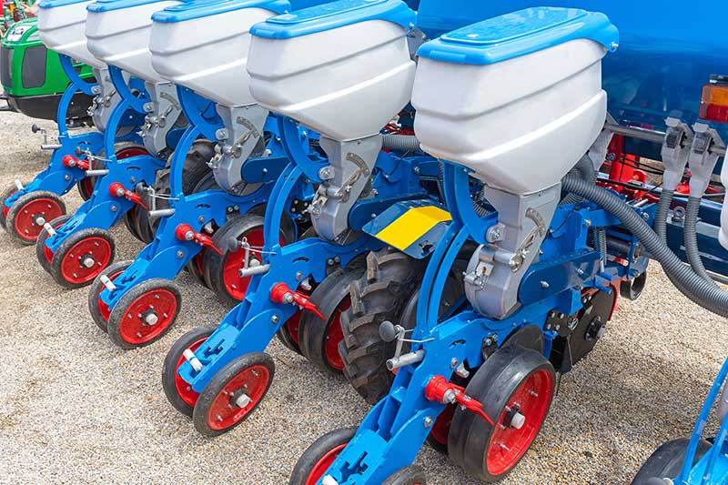 close up of blue seed drill components, grain drill financing