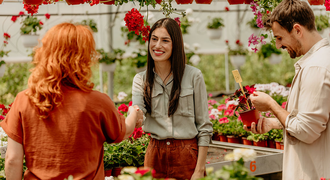 smiling customer at a flower shop, how to boost customer retention