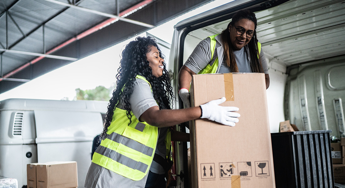 two delivery workers unloading a work van, business use of vehicles, a helpful guide